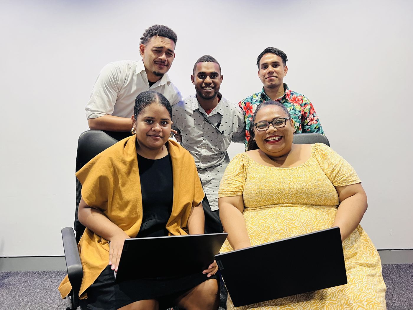 NexOutsource team members together in the Suva office